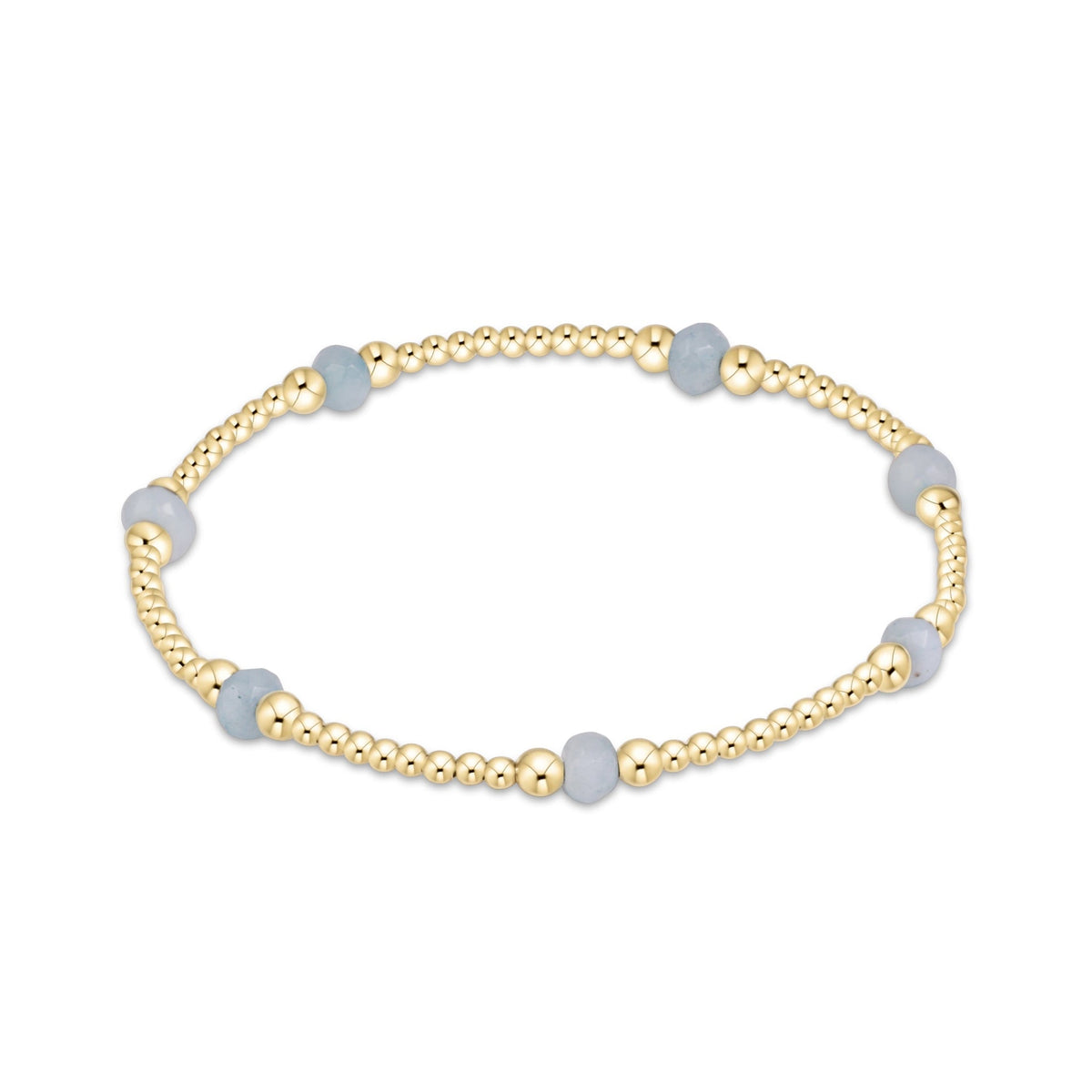 A delicate beaded stretch bracelet featuring small gold-toned metallic beads and larger light blue round stone beads.