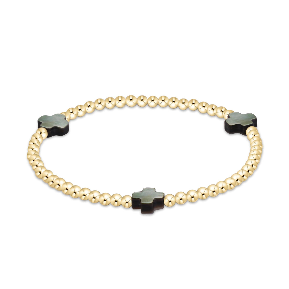 A gold beaded bracelet with three dark green clover-shaped charms, photographed on a clean white background.