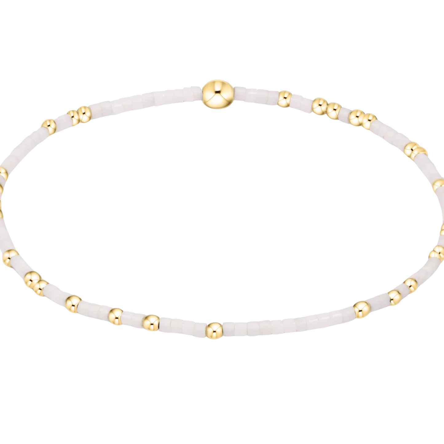 White bracelet with gold accents