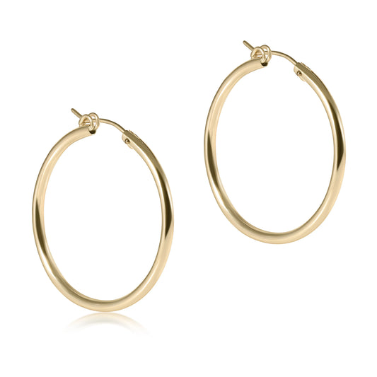 Gold hoop earrings on a white background