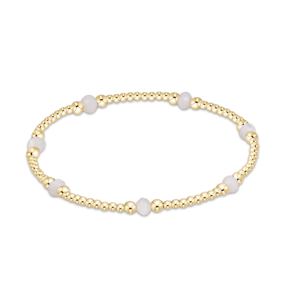 A delicate beaded bracelet featuring gold-toned metallic beads and smooth, pale white oval accents.
