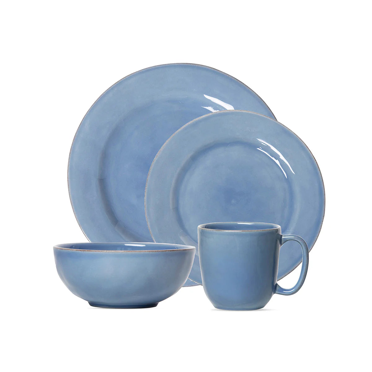 Set of blue ceramic dinnerware including plates, bowl, and mug on a white background