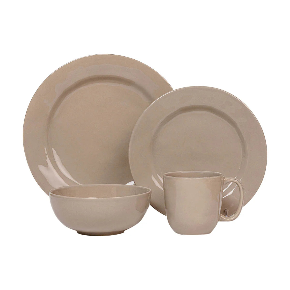 Beige ceramic dinnerware set on a white background