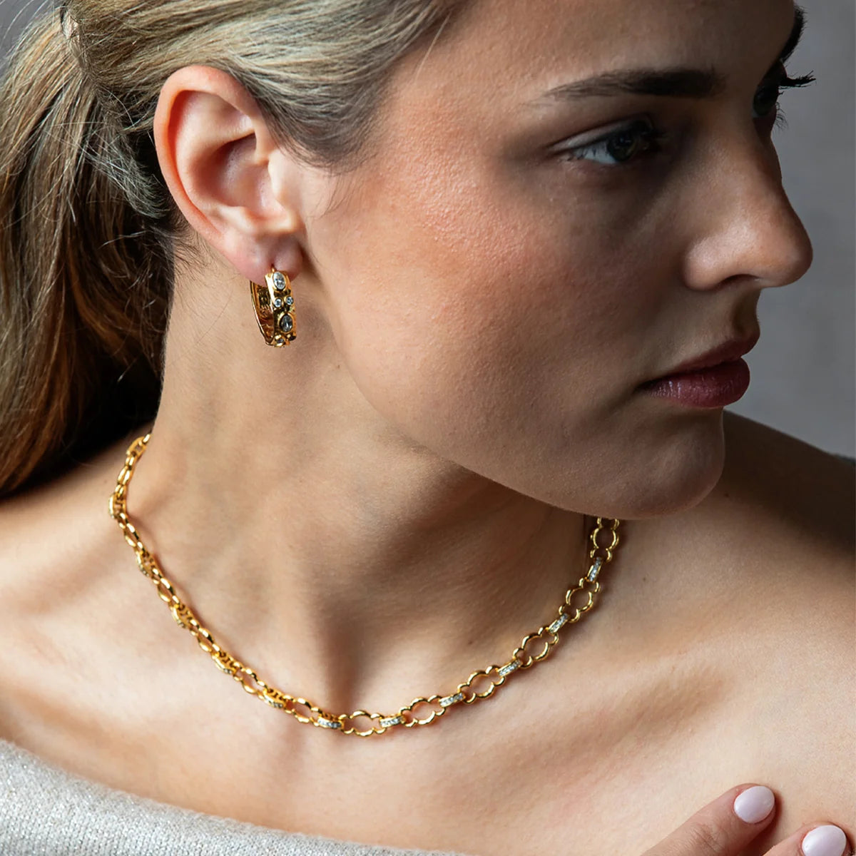 Maharani Huggie Hoop Earrings in Gold with Clear Cubic Zirconia, Capucine de Wulf