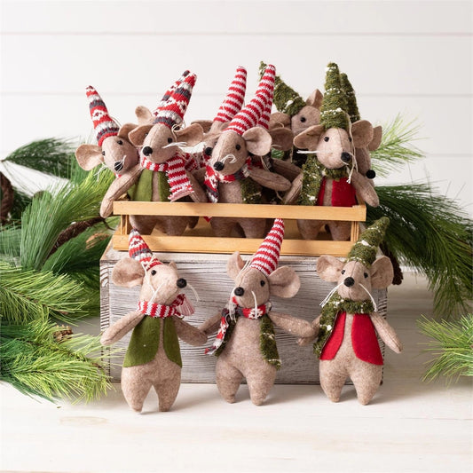 A milk crate full of assorted felt mice with varying vests, scarves, and hats that are green, red, and white with varying patterns.