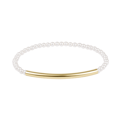 Pearl bracelet with a gold bar on a white background