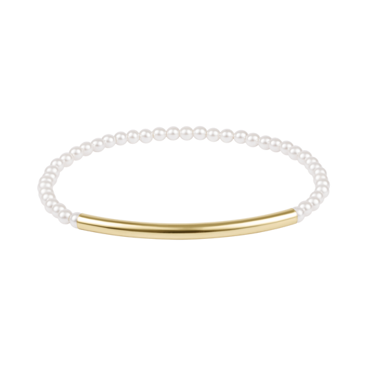 Pearl bracelet with a gold bar on a white background