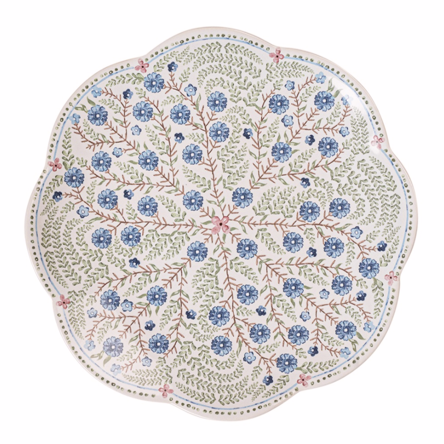 Decorative scalloped salad plate with blue. green, and pink floral pattern on a white background