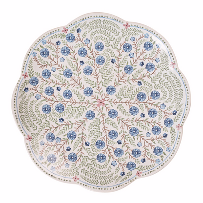 Decorative scalloped salad plate with blue. green, and pink floral pattern on a white background