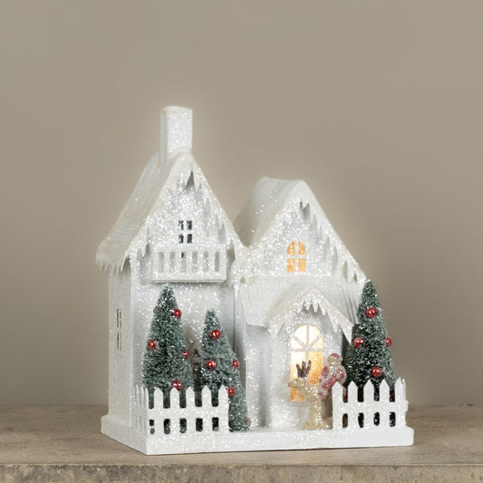 Lighted Snow Covered House with Balcony