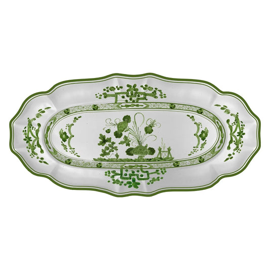 Decorative white platter with green floral patterns on a white background