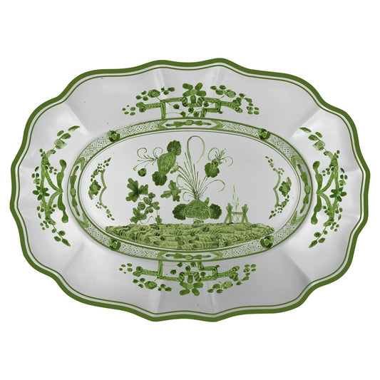 Decorative plate with green floral patterns on a white background