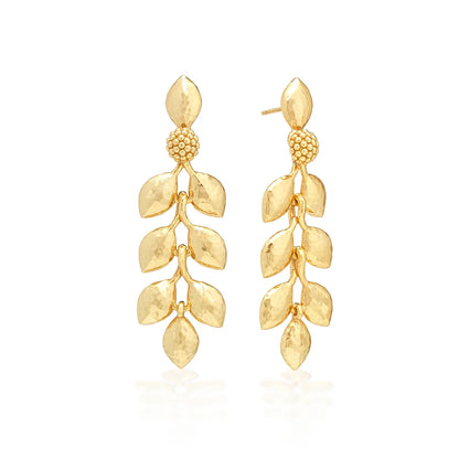 A pair of gold dangle earrings designed as leafy vines, set against a clean white background.