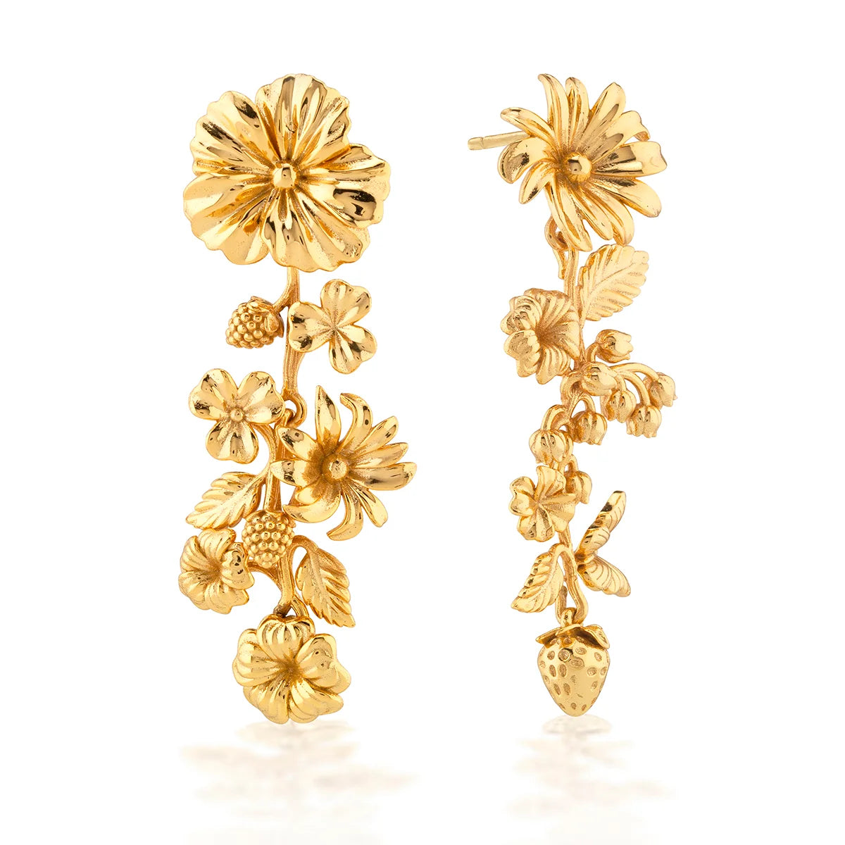 Gold floral earrings on a white background