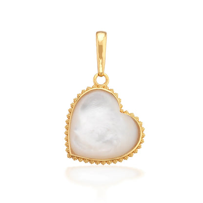 Gold pendant with a heart-shaped white stone on a white background