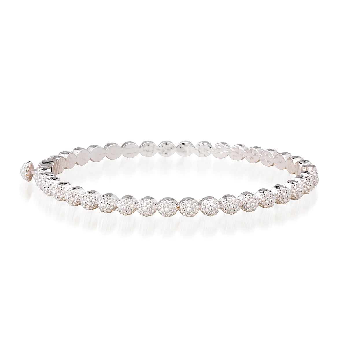A silver tennis bracelet featuring round beads displayed on a clean white background