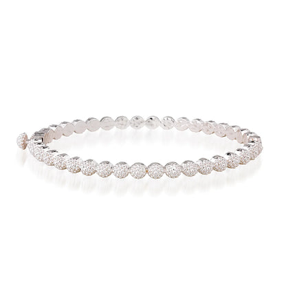 A silver tennis bracelet featuring round beads displayed on a clean white background