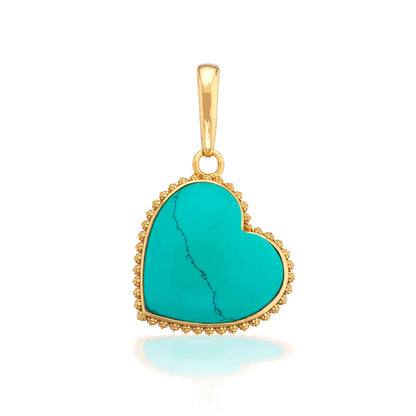 Turquoise heart-shaped pendant with gold frame on a white background