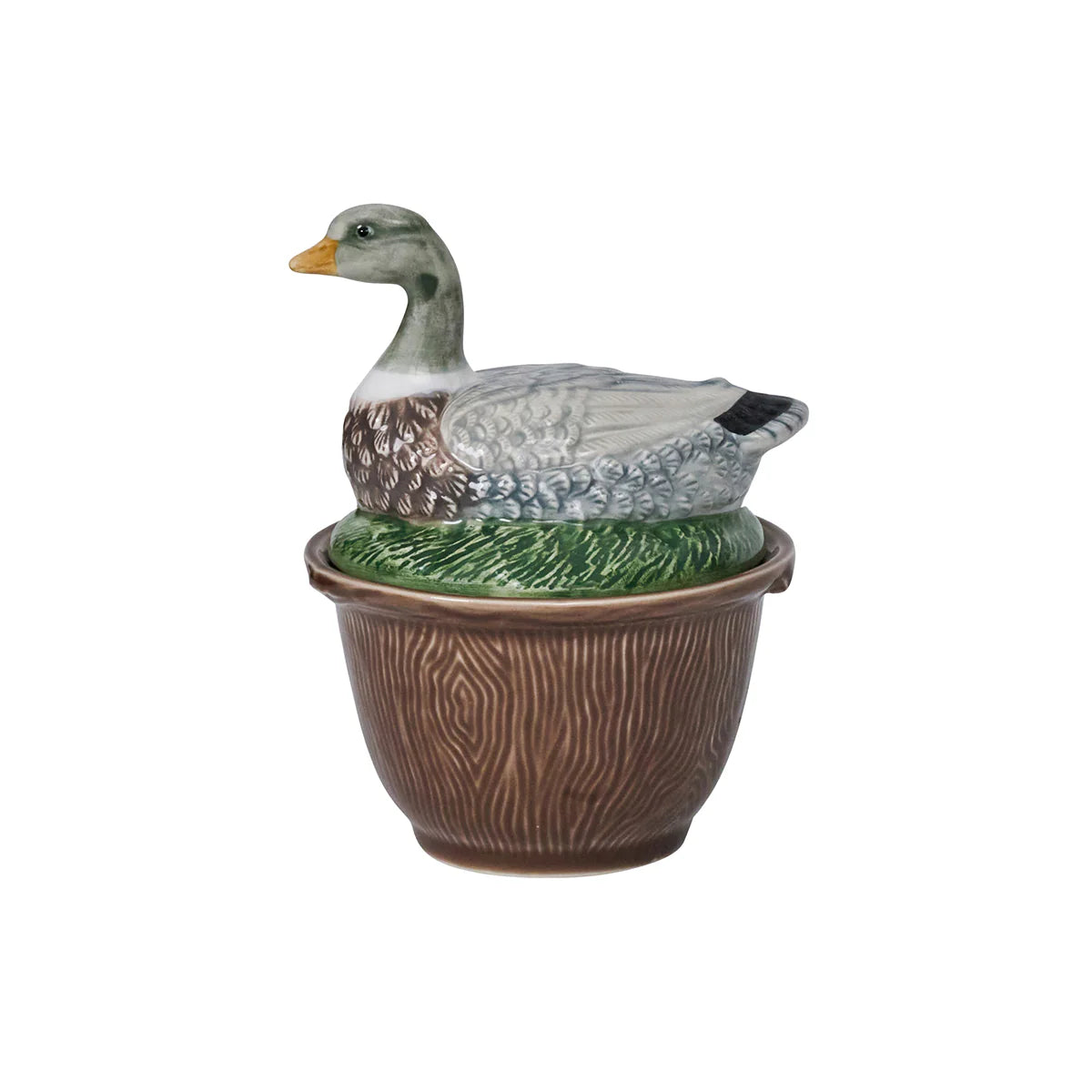 A brown-ceramic, faux bois bowl with a lid with a duck laying in grass.