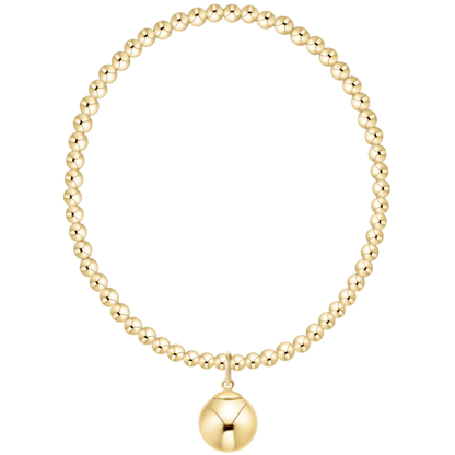 Gold beaded necklace with a round pendant on a white background