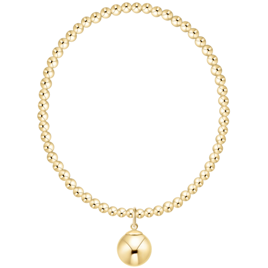Gold beaded necklace with a round pendant on a white background