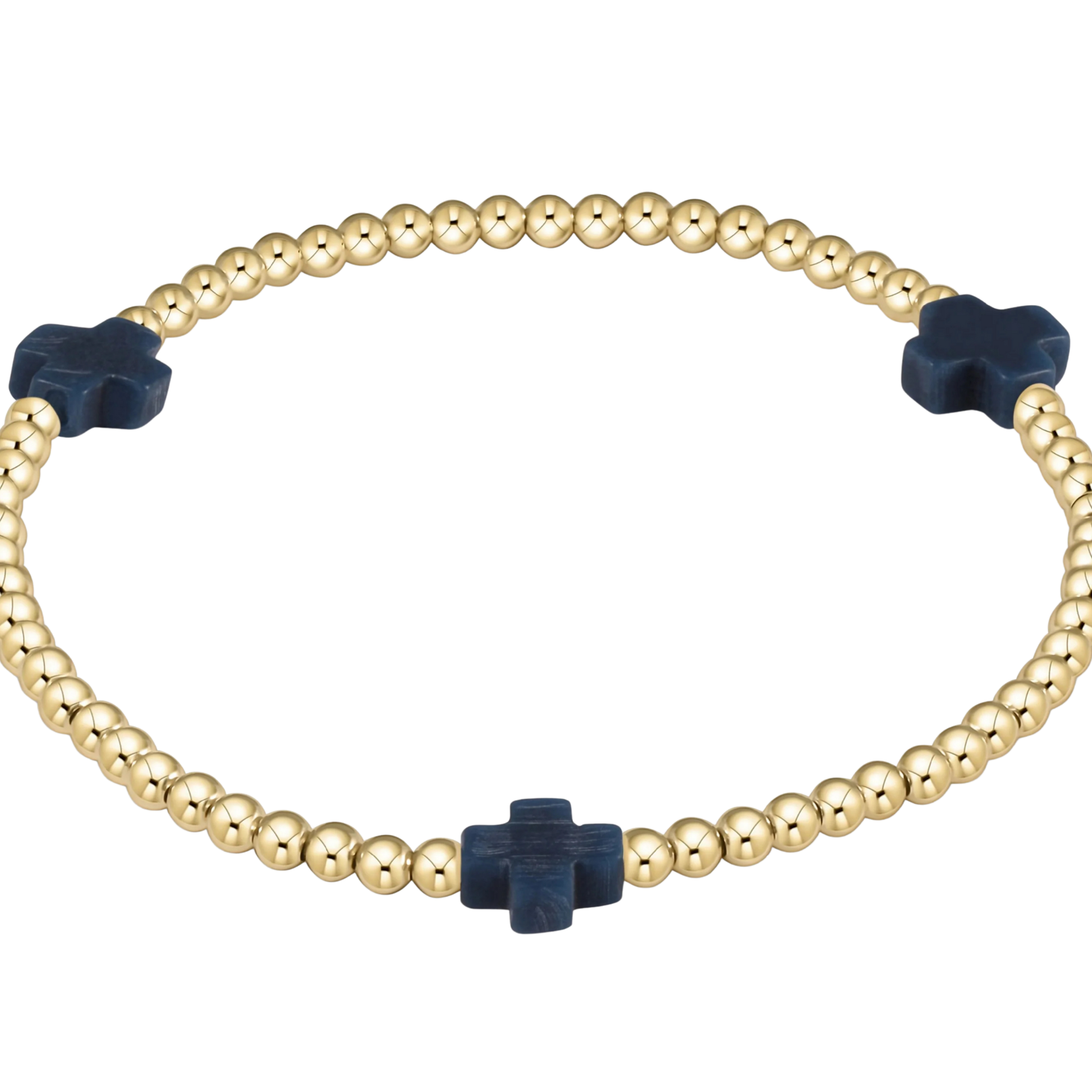Gold beaded bracelet with navy blue cross-shaped beads on a white background