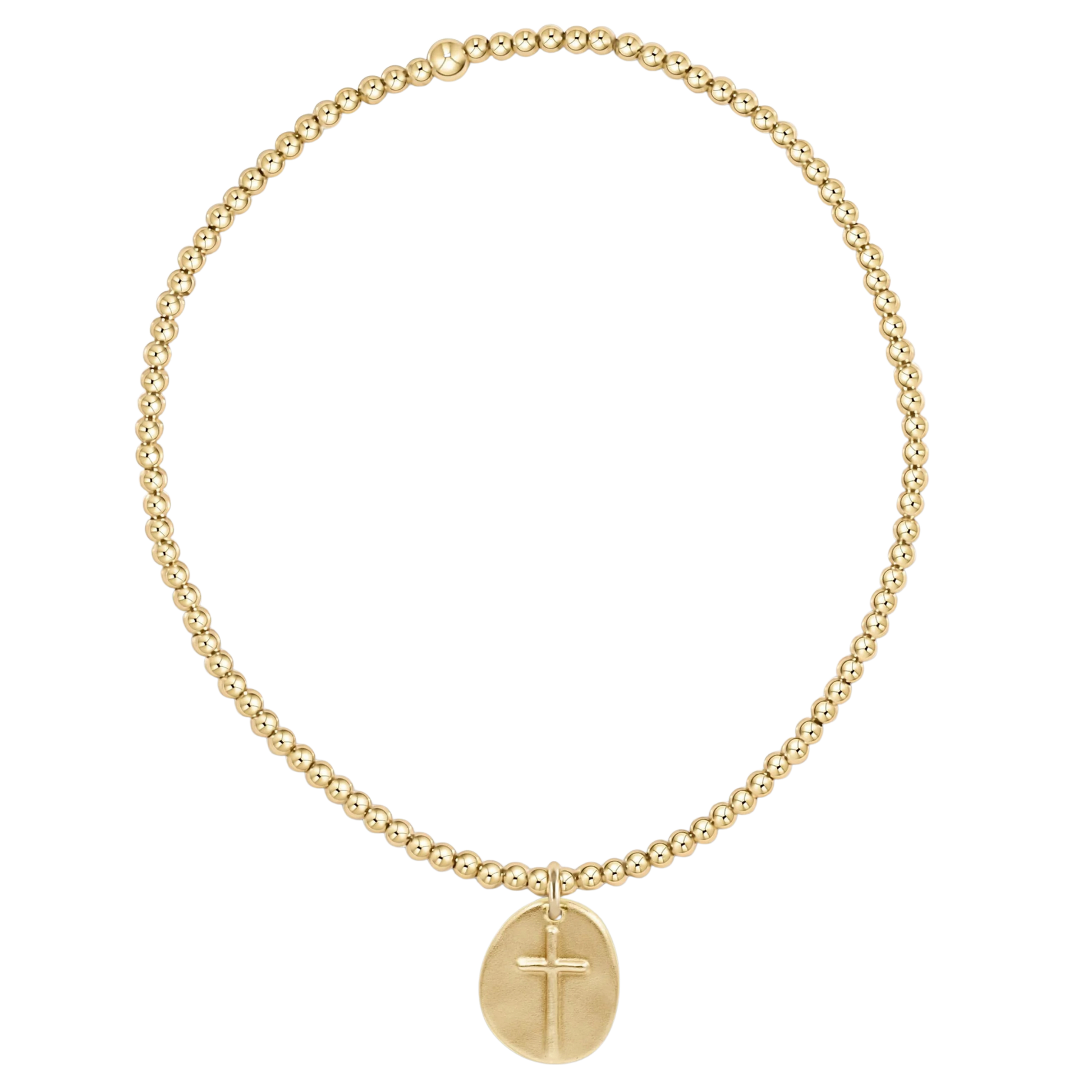 Gold bracelet with a cross pendant on a white background