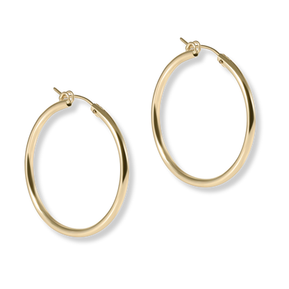 Gold hoop earrings on a white background