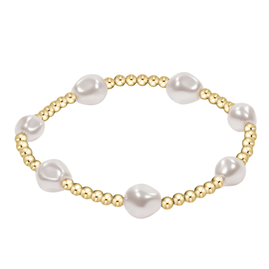Pearl and gold beaded bracelet on a white background