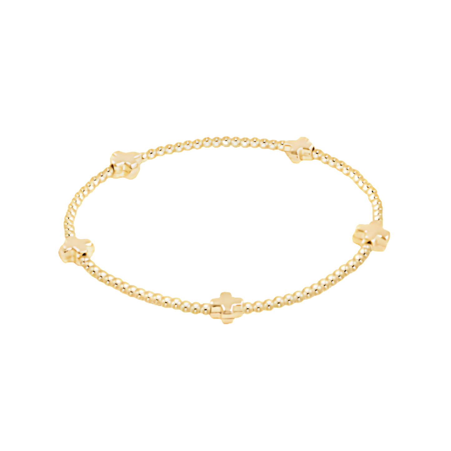 Gold bracelet with small cross beads on a white background