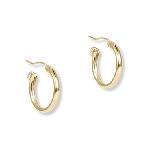 Gold hoop earrings on a white background