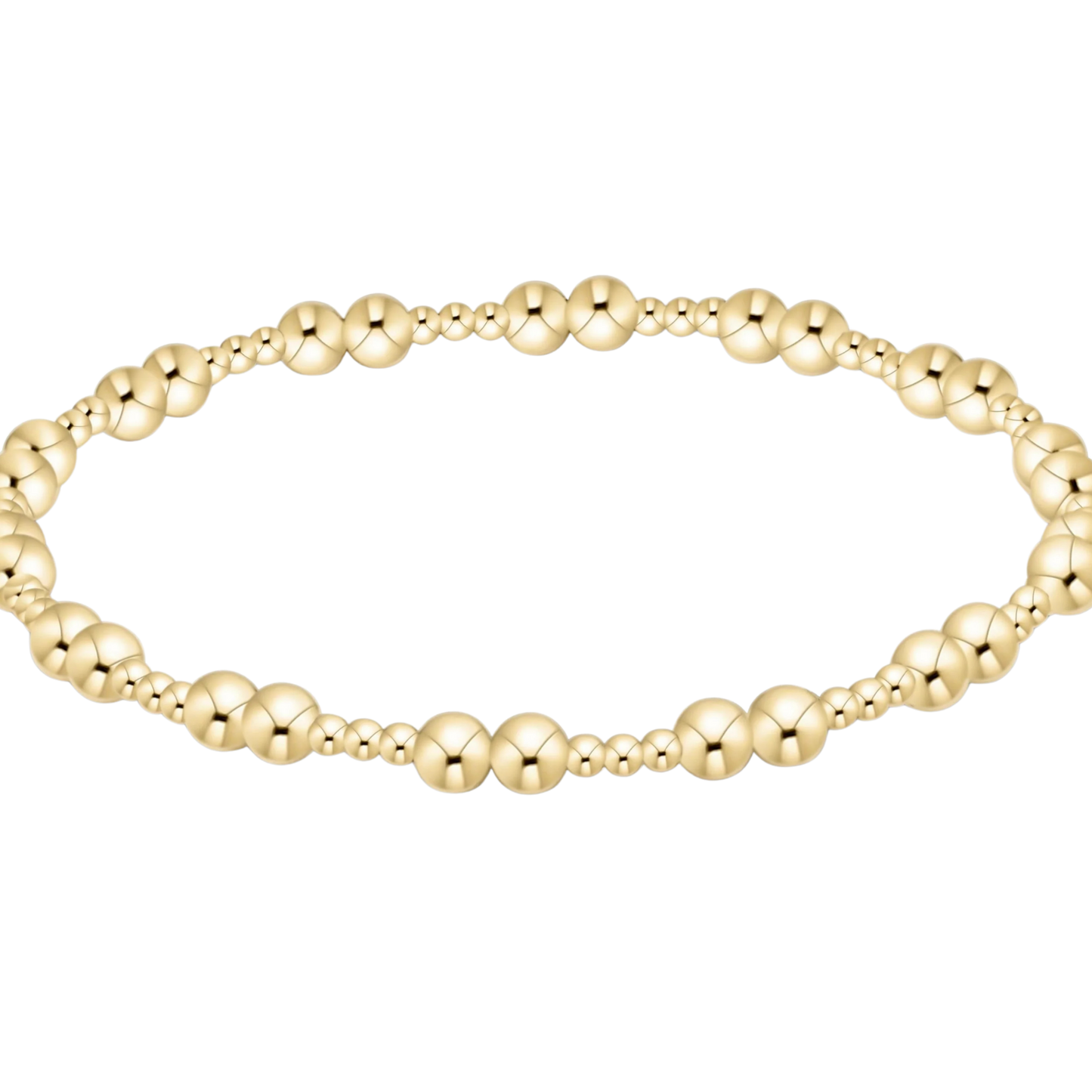 Gold beaded bracelet on a white background