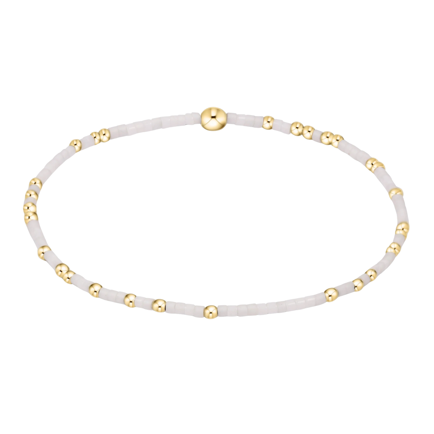 White beaded bracelet with gold accents