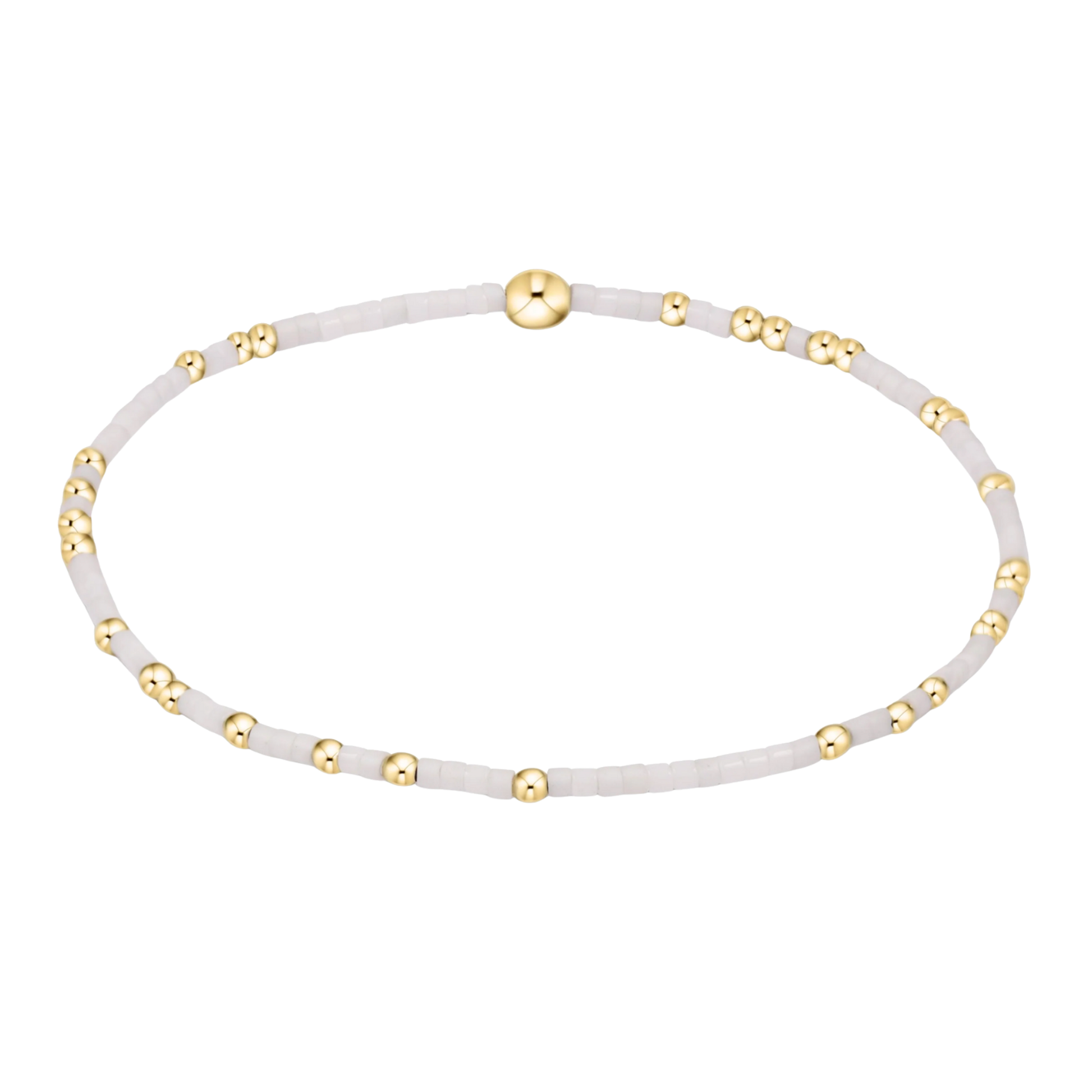 White beaded bracelet with gold accents