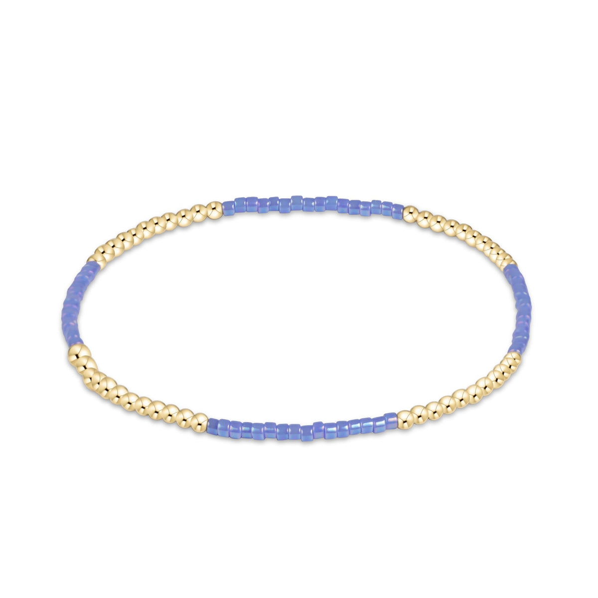 A beaded stretch bracelet featuring alternating sections of small metallic gold beads and translucent light blue beads.
