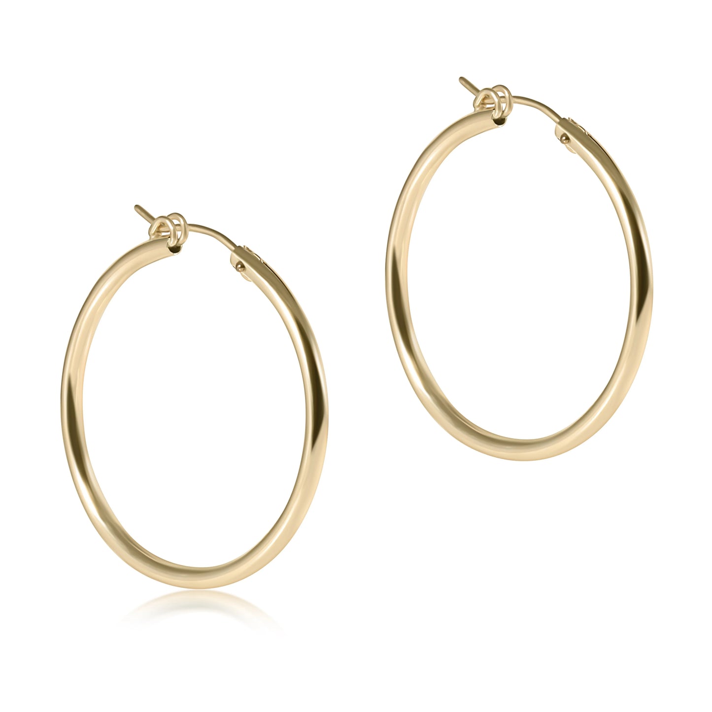 Gold hoop earrings on a white background