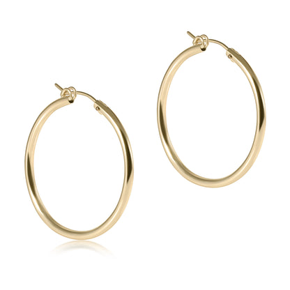 Gold hoop earrings on a white background