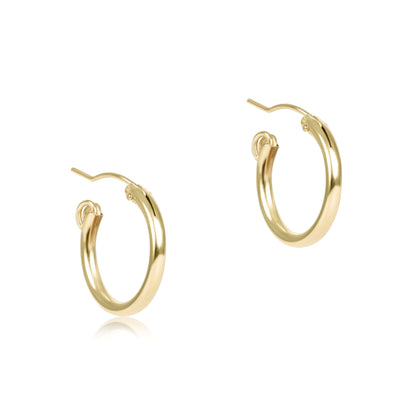 Gold hoop earrings on a white background