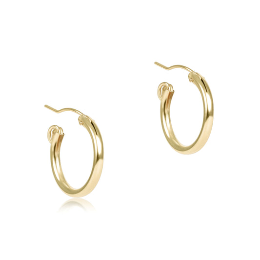 Gold hoop earrings on a white background