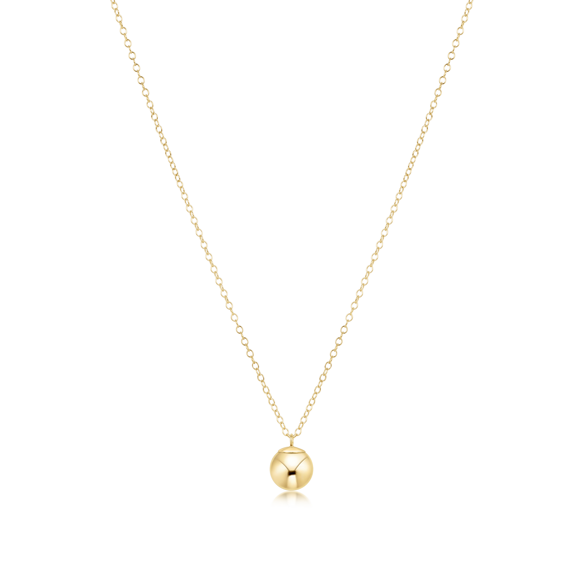 Gold necklace with a round bead charm on a white background