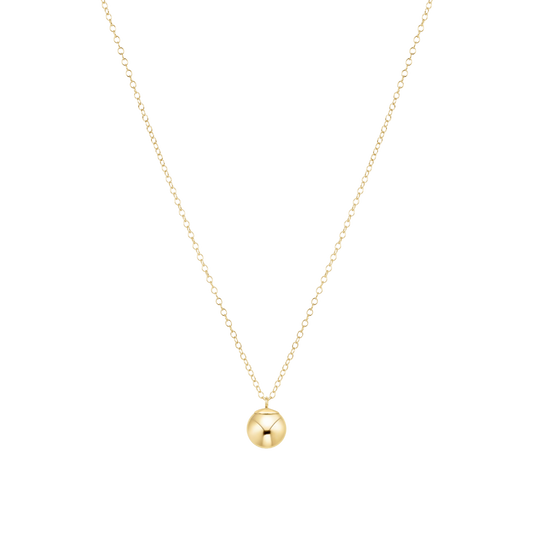 Gold necklace with a round bead pendant on a white background