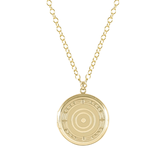 Gold necklace with a circular pendant on a white background