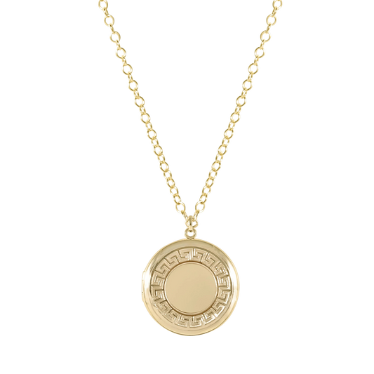 Gold necklace with a round pendant on a white background