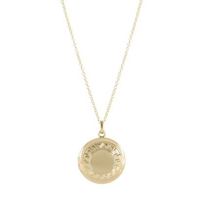 Gold necklace with a round pendant on a white background