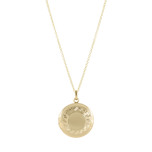 Gold necklace with a round pendant on a white background