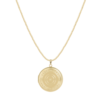 Gold necklace with a round pendant on a white background