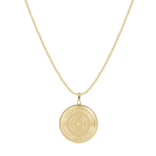 Gold necklace with a round pendant on a white background