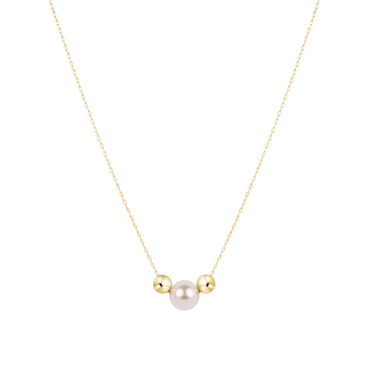 Necklace with a single pearl and two gold beads on a white background