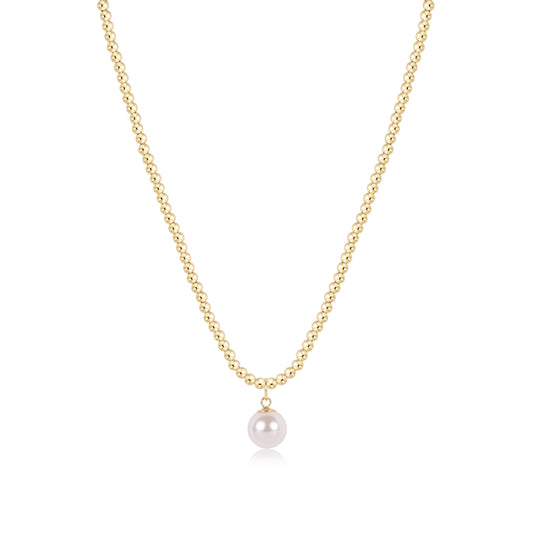 A delicate gold chain necklace featuring a single, lustrous white pearl pendant, presented on a clean white background.