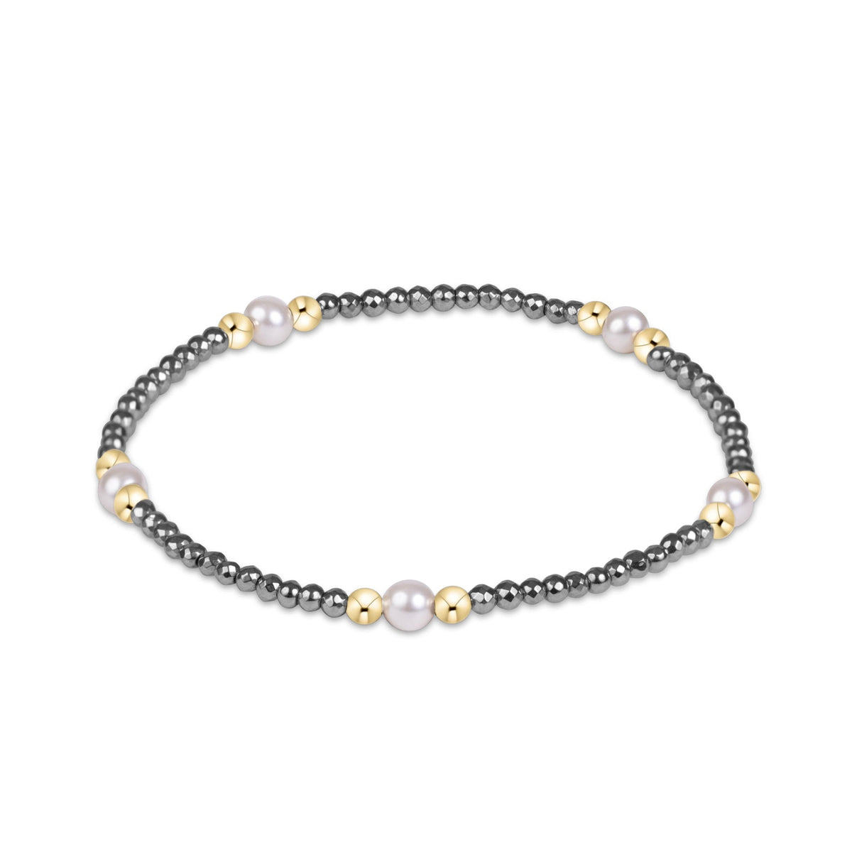 A beaded stretch bracelet featuring dark gray metallic beads, small gold spacer beads, and three larger white pearl-like beads.